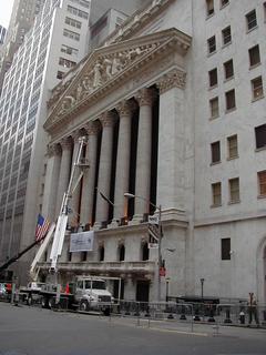 Hanging Christmas lights on the New York Stock Exchange<br>Location: <a href="https://www.google.com/maps/search/?api=1&query=40.70712,-74.01059" target="_new">Wall St and Broad St</a>